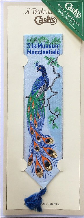 Cash's woven bookmark with woven title words and image of a peacock