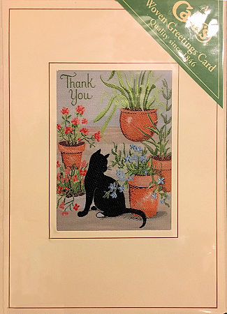 J & J Cash's greetings card with words woven on tapestry, THANK YOU, and image of a black cat sitting on patio with plant pots