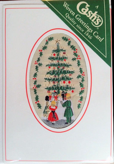 J & J Cash woven Christmas card, with no words, with primary image of a Christmas Tree and three children