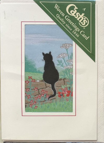 J & J Cash woven card, with no words, but picture of a Black Cat sitting on wall
