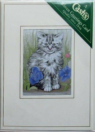 J & J Cash woven card, with no words, but picture of a grey fluffy kitten and blue flowers