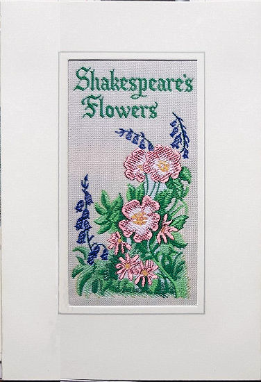 J & J Cash woven flower card, with title words, SHAKESPEARE'S FLOWERS, and image of pink flowers & bluebells