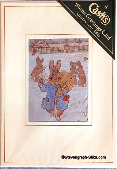J & J Cash woven card, with no title words, but image of Rabbits carrying a bag of Christmas post