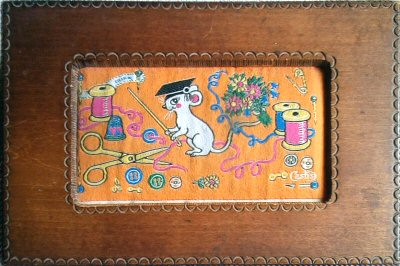 J & J Cash wooden box with woven picture of a cartoon mouse with sawing equipment