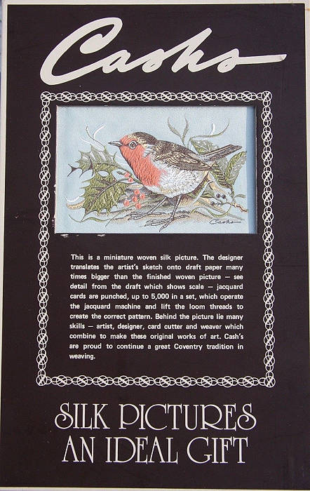 J & J Cash counter display with a woven picture of a robin
