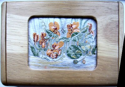 J & J Cash wooden box with inlayed lid, with picture of a group of unknown flowers