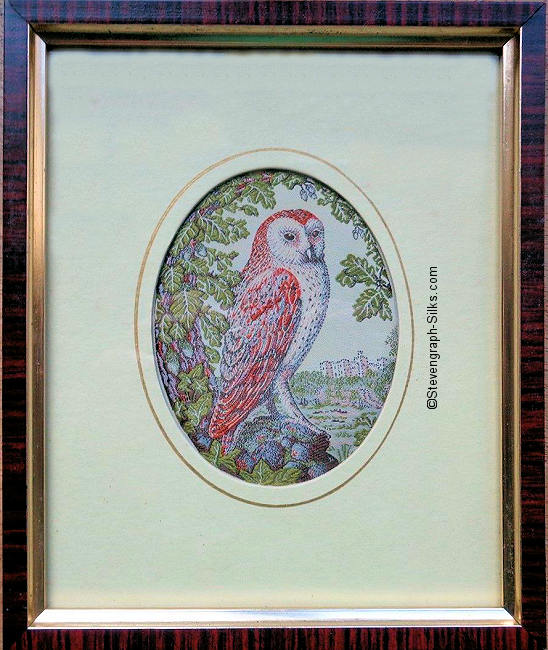 Framed woven picture of an owl in a tree, with a castle in the background