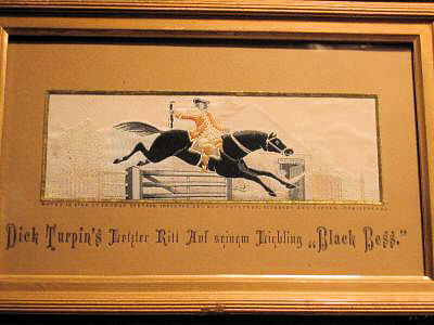 Image of Dick Turpin jumping over the toll gate, on his horse, Black Bess, with words in German, Dick Turpins letzter Ritt auf seinem Liebling "Black Bess"