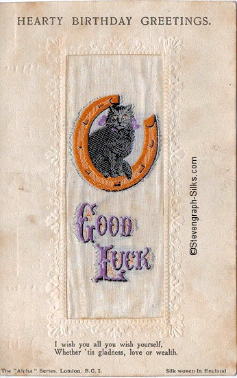Stevens Alpha series postcard with image of a cat sat on a horse shoe