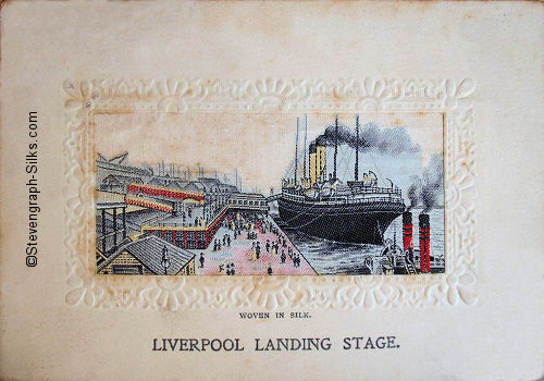 View of Liverpool landing stage, with ocean liner tied up with a tug behind with red funnels, and passengers walking on the docks
