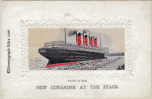 View of ocean liner tied up at the docks, with boarding passageway, and people on the docks. The name " LUSITANIA " is visible on the stern of the ship
