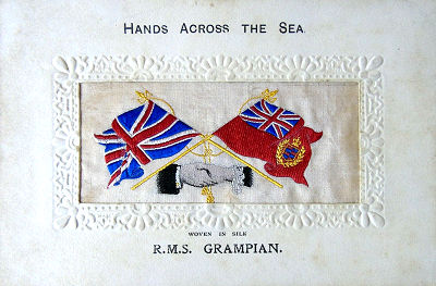 Hands Across the Sea silk postcard with images of hands, flags and tassles