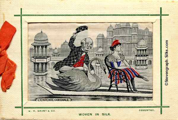 front cover of Grant 1908 Christmas card, with woven silk picture of a man riding a swan, and lady sat on chair in front