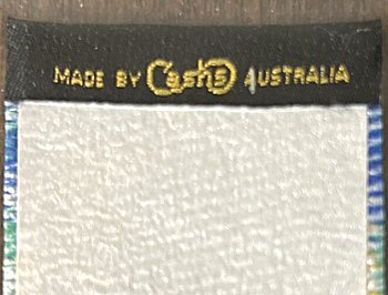 J & J Cash name woven on the rear top turnover of this bookmark