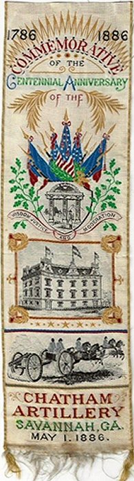 Cash's woven bookmark with words, and views of flags, a building and horse drawn carriages