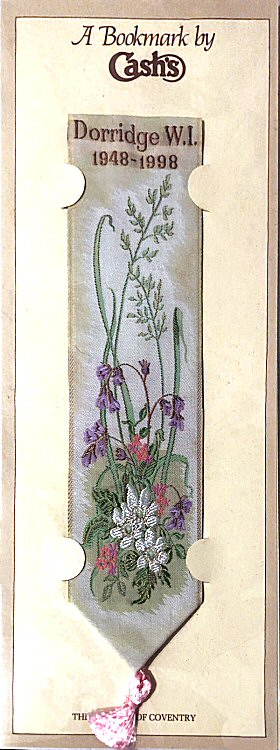 Cash's bookmark with title of Dorridge W.I. 1948-1998 and images of various flowers and grasses