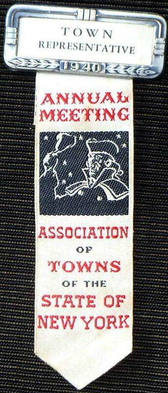 J & J Cash bookmark or badge, woven with title words and image of town crier with a handbell