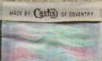 woven name of Cash's on the reverse top turnover of this bookmark