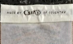 woven J & J Cash name on reverse top turnover of this bookmark