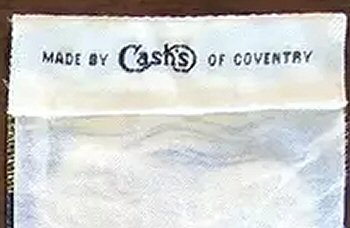 Cash's name woven on reverse top turnover of this bookmark