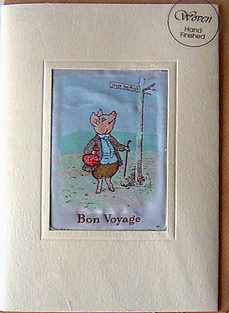 J & J Cash's greetings card with words woven on tapestry, BON VOYAGE, and image of a pig