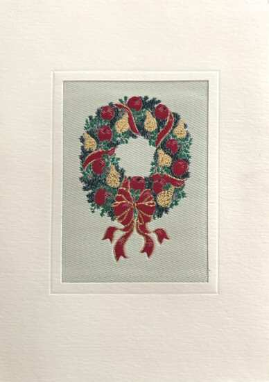 J & J Cash woven Christmas card, with no words, just image of a wreath with bow and ribbon