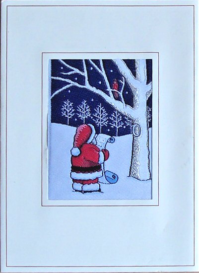 J & J Cash woven Christmas card, with no words, just image of Father Christmas with long shopping list