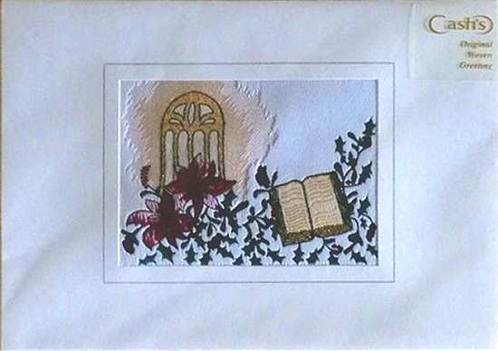 J & J Cash woven Christmas card, with no words, just image of a church window and a bible