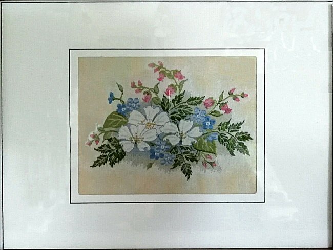 J & J Cash woven flower card, with landscape image of white, blue and other flowers)