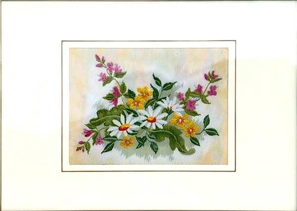 J & J Cash woven flower card, with landscape image of Daisies, with white with yellow & pink flowers