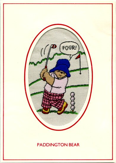 J & J Cash woven card, with title words only: Paddington Bear, but woven image of Paddington playing golf, saying FOUR