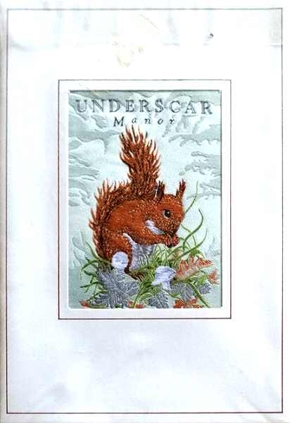 J & J Cash woven card, with woven title words: Underscar Manor