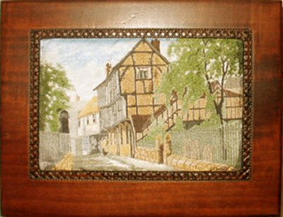 J & J Cash wooden box with woven picture of a atreet of timber framed houses, recorded by CASH'S as Priory Row