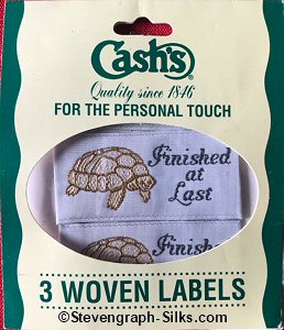 J & J Cash woven saw-on label with words: FINISHED AT LAST