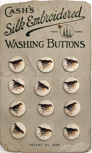J & J Cash woven silk buttons mounted on a card, with title of Washing buttons