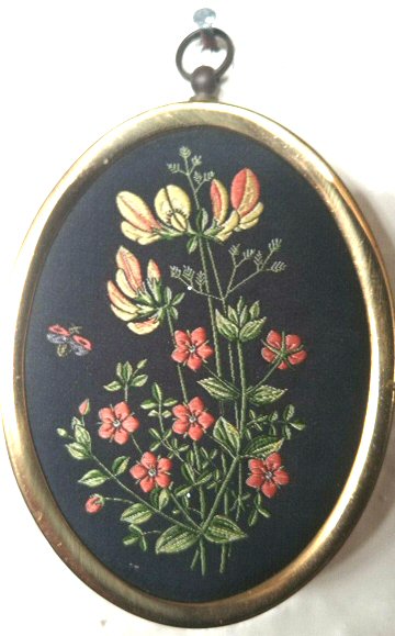J & J Cash woven silk oval brooch of Pasture European Wild Flowers - Birdsfoot Trefoil, Scarlet Pimpernel & Small Meadow Grass