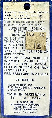 J & J Cash woven saw-on label reverse