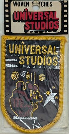 J & J Cash woven saw-on label with words: Universal Studios