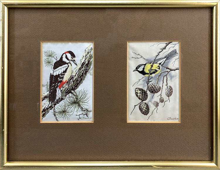 J & J Cash woven picture with two pictures in one frame; being a Great Spotted Woodpecker with Great Tit