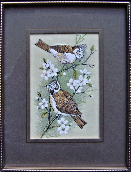 J & J Cash woven picture of a bird, with no words, but image of a pair of Crested Tits