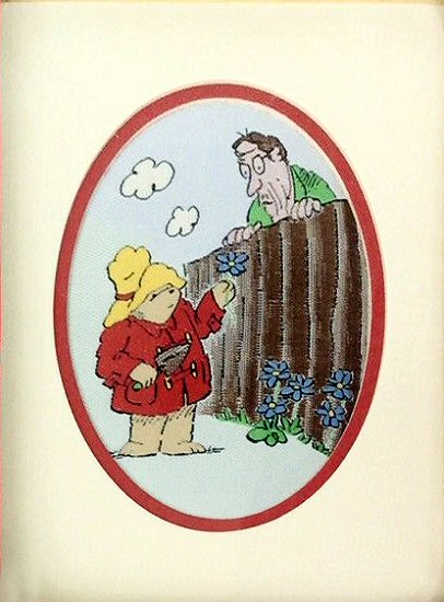 J & J Cash small oval centred woven picture with image of Paddington Bear in the garden
