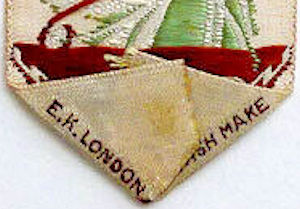 Woven signature on bottom reverse pointed end of this bookmark