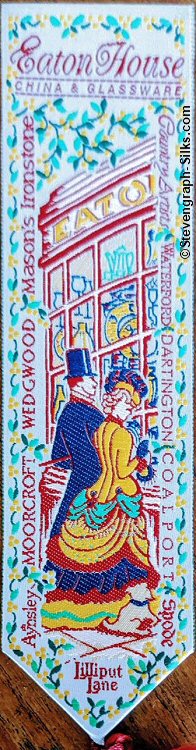 bookmark with title words, view of two people entering a shop and names round the edge of the bookmark