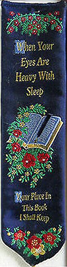 woven bookmark with words, When your eyes are heavy with sleep, Your place in this book I shall keep, and image of an open book