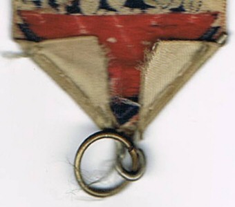 Close-up of the reverse pointed end, showing the addition of the ring to support a medal