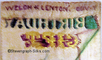 logo woven on reverse top turn over of this bookmark