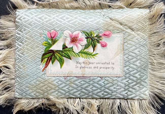 front printed card attached to padded cushion