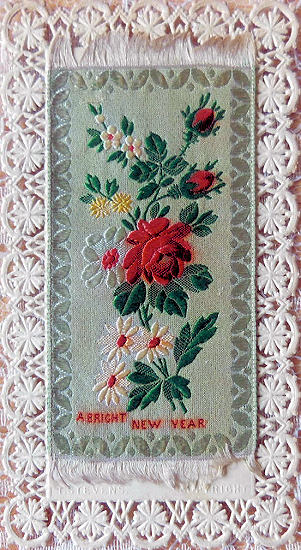 green rectangular silk mounted on card with ornate die-cut lace border - " A Bright New Year "