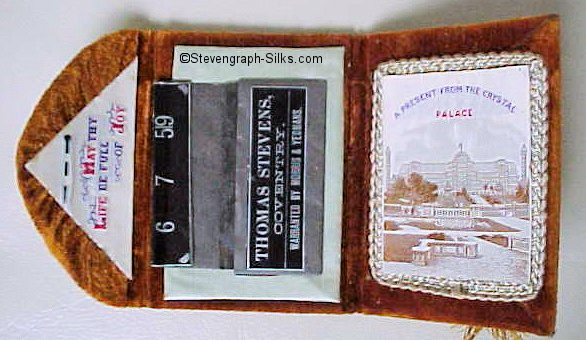 needle case, with woven silk on the fold over flap, with words "May Thy Life be full of Joy", and view of the Crystal Palace