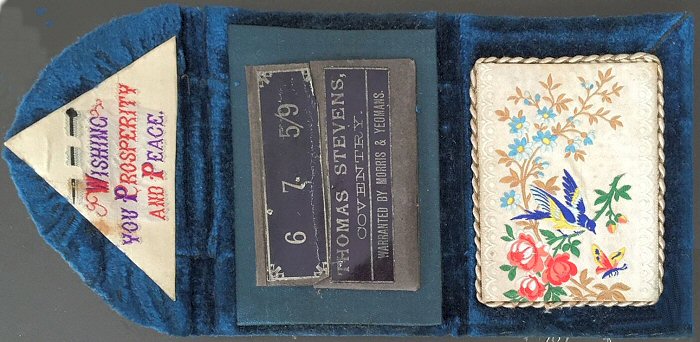 needle case with woven silk on the fold over flap, with words "Wishing You Prosperity and Peace"